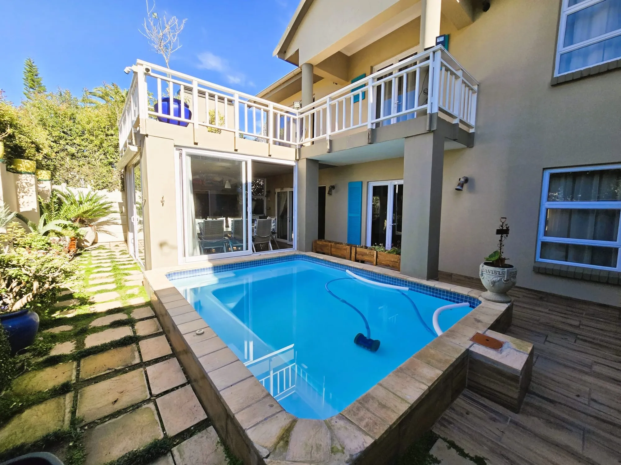 The pool and deck at Vibe Beach House